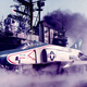 A US Marine Corps RF-4B Phantom II from Marine photo reconnaissance squadron VMFP-3 “Eyes of the Corps” prepares to launch from the USS Midway in 1976. Note the camera ports in the nose, as well as the aircraft’s Bicentennial livery. (Chuck Walters, USMC)